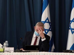 Israeli defence minister and alternate prime minister Benny Gantz wears a protective mask as he attends the weekly cabinet meeting at the foreign ministry in Jerusalem on July 5, 2020. GALI TIBBON / POOL / AFP
