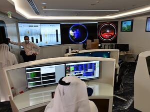 Employees work at the control room of the Mars Mission at the Mohammed Bin Rashid Space Centre (MBRSC), in the Gulf emirate of Dubai. The oil-rich United Arab Emirates has built a nuclear power programme and sent a man to space, and now plans to join another elite club by sending a probe to Mars. GIUSEPPE CACACE / AFP