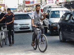 Hamuda's modest coffee on wheels business is giving the coastal Palestinian territory its first taste of a delivery service inspired by the likes of Uber Eats or Deliveroo. SAID KHATIB / AFP