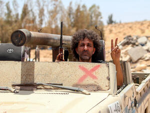 Fighters loyal to the UN-recognised Libyan Government of National Accord (GNA) secure the area of Abu Qurain, half-way between the capital Tripoli and Libya's second city Benghazi, against forces loyal to Khalifa Haftar, who is based in eastern Benghazi, on July 20, 2020. Mahmud TURKIA / AFP