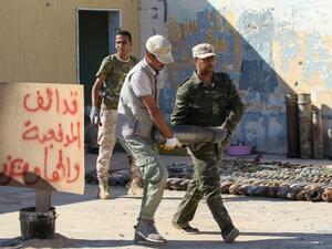 Military engineers, of the UN-recognised Libyan Government of National Accord (GNA), sort ammunition and explosives, uncovered from areas south of the capital, ahead of disposing of them in the Libyan capital Tripoli on July 22, 2020. Mahmud TURKIA / AFP