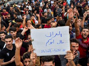 “Iraq doesn't belong to your father” - protesters chant slogans during a demonstration across Baghdad, Najaf and Nasiriyah. “We don't want this corrupt government," protesters have chanted. “All are corrupt equally!" (Haidar Hamdani/AFP)