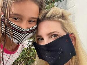 She had previously urged others to wear masks while posting this picture with her daughter Arabella (Instagram)