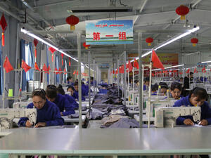 Uigur women work in a cloth factory in Hotan county, Xinjiang province, China. (Shutterstock/ File Photo)