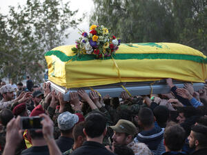 Hezbollah Funeral,where village citizens and Hezbollah soldiers carry the coffin of "Mohammad Wehbi" the Hezbollah fighter who was killed in Syria war. (Shutterstock/ File Photo)
