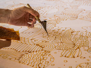 Candles line paint fabric batik. (Shutterstock/ File Photo)