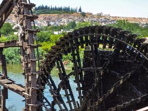 The water wheels or ‘norias’ of Hama were used for centuries to bring water to gardens and buildings on the shores of the Orontes River. (AFP)