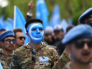 Ethnic Uighurs take part in a protest march in Brussels asking for the EU to call upon China to respect human rights (AFP/File photo)