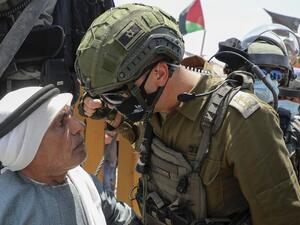 An Israeli border guard faces off with an elderly Palestinian man taking part in a demonstration to protest Israel's plan to annex parts of the occupied West Bank, in the Palestinian village of Haris, southwest of Nablus, on July 24, 2020. JAAFAR ASHTIYEH / AFP