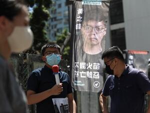  this file photo taken on July 11, 2020, pro-democracy activist Joshua Wong (C), a candidate of Kowloon East constituency, campaigns during a primary election to select the pro-democracy opposition candidates for election to the city's legislative council in September, in Hong Kong. (AFP/File)