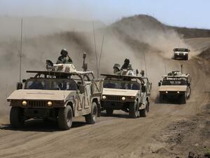Israeli army training humvees equipped with mock cannon turrets drive during a drill in the Israeli-annexed Golan Heights, near Merom Golan on the border with Syria, on August 3, 2020. JALAA MAREY / AFP