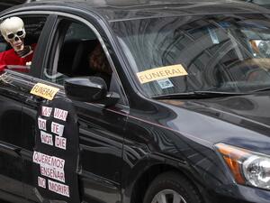 Teachers and activists hold car caravan all over the country on August 3, 2020 to demand adequate classroom safety measures as schools debate reopening. KAMIL KRZACZYNSKI / AFP