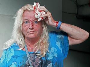Valarie Fakhoury, a British-Lebanese national, stands outside the emergency ward of a hospital in the Hamra district of central Beirut following a huge explosion that rocked the Lebanese capital on August 4, 2020. A large explosion rocked the Lebanese capital Beirut on August 4, an AFP correspondent said. The blast, which rattled entire buildings and broke glass, was felt in several parts of the city. Janine HAIDAR / AFP