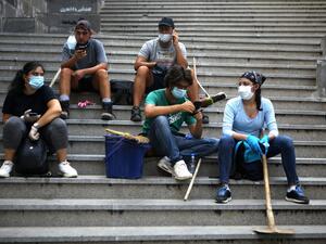 A Lebanese couple inspect the damage to their house in an area overlooking the destroyed Beirut port on August 5, 2020 in the aftermath of a massive explosion in the Lebanese capital. Rescuers searched for survivors in Beirut after a cataclysmic explosion at the port sowed devastation across entire neighbourhoods, killing more than 100 people, wounding thousands and plunging Lebanon deeper into crisis. The blast, which appeared to have been caused by a fire igniting 2,750 tonnes of ammonium nitrate left uns