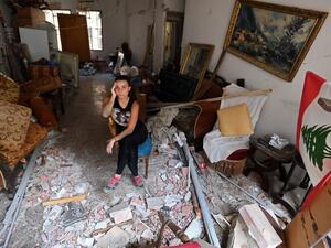 A woman sits amidst the rubble in her damaged house in the Lebanese capital Beirut on August 6, 2020, two days after a massive explosion shook the Lebanese capital. (AFP/ File Photo)