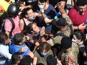 Lebanese anti-government protesters scuffle with security forces in the Gemayzeh neighbourhood during the visit of French President Emmanuel Macron on August 6, 2020, two days after a massive explosion in the Beirut port shook the capital. The blast caused massive destruction and killed at least 113 people, heaping misery on a country in crisis. AFP