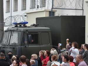 A police van drives out of a detention centre while allegedly transporting people who were jailed to different terms for participating in recent rallies of opposition supporters, who accuse strongman Alexander Lukashenko of falsifying the polls in the presidential election, in Minsk on August 12, 2020. Sergei GAPON / AFP