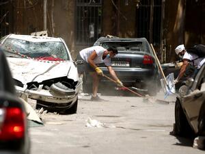 Volunteer clear the rubble in the Beirut neighbourhood of Mar Mikhael on August 14, 2020, more than a week after a massive blast ravaged the port and parts of the Lebanese capital. The catastrophic Beirut explosion on August 4 killed 171 people, injured thousands and laid waste to whole neighbourhoods. PATRICK BAZ / AFP