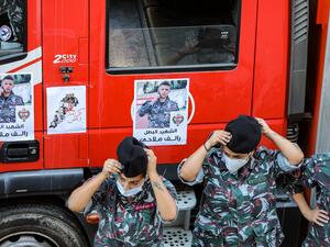 Firefighters attend a funerary ceremony for their comrade Ralph Malahi, who was killed in the monster explosion at the port of Beirut and whose remains were recently found and identified, at the civil defence headquarters in the Karantina (La Quarantaine or Quarantina) neighbourhood of the capital just by the ravaged port, on August 15, 2020. ANWAR AMRO / AFP