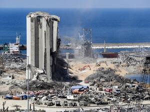 Diggers remove earth at the blast site next to the silos at the port of Beirut on August 16, 2020, in the aftermath of the massive explosion there that ravaged Lebanon's capital. ANWAR AMRO / AFP