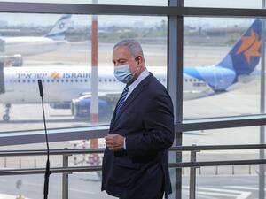 Israeli Prime Minister Benjamin Netanyahu arrives to make a speech during a visit to the Ben Gurion International Airport in Lod, on August 17, 2020. Emil Salman / POOL / AFP