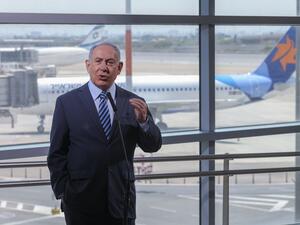 Israeli Prime Minister Benjamin Netanyahu speaks during a visit to the Ben Gurion International Airport in Lod, on August 17, 2020. Israel said on August 16 that citizens, residents and foreign workers returning from 20 countries would be exempted from a 14-day coronavirus quarantine period, but kept its borders closed to tourists. Emil Salman / POOL / AFP