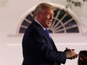 U.S. President Donald Trump applauds as he arrives to listen to first lady Melania Trump's address to the Republican National Convention from the Rose Garden at the White House on August 25, 2020 in Washington, DC. The convention is being held virtually due to the coronavirus pandemic but will include speeches from various locations including Charlotte, North Carolina and Washington, DC. Alex Wong/Getty Images/AFP ALEX WONG / GETTY IMAGES NORTH AMERICA / Getty Images via AFP