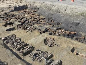 Excavations at a construction site for a train station in Japan have revealed an burial ground containing the bones of 350 people in tiny round graves, pictured. (Osaka City)