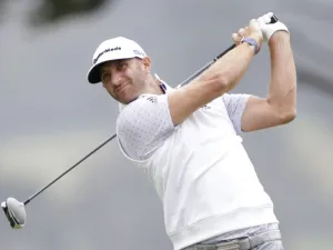 Dustin Johnson hits a tee shot on the 4th hole in the third round of the 102nd PGA Championship on Saturday at TPC Harding Park in San Francisco. (Photo: John Angelillo/UPI)