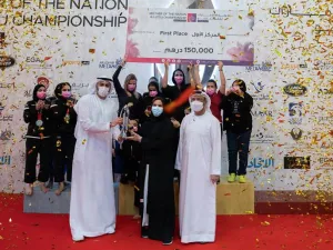Al Wahda Jiu-Jitsu Club with the overall championship trophy. -- Supplied photo