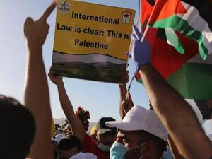 Palestinians participate in a big rally to protest against Israel's plan to annex parts of the occupied West Bank, in Jericho on June 22, 2020. (AFP)