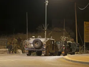Israeli soldiers gather near the site of a fire on the border fence with Syria, near the Druze village of Majdal Shams in the Israel-annexed Golan Heights on August 31, 2020. JALAA MAREY / AFP