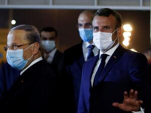 French President Emmanuel Macron (R) and Lebanese President Michel Aoun, both wearing face masks due to the Covid-19 pandemic, are pictured at Beirut International airport, on August 31, 2020. Macron arrived in Beirut for his second visit since a deadly explosion on August 4 shook the nation and fuelled a drive for political change. Macron, who first flew to Beirut only two days after the blast, arrived at 9 pm (1800 GMT) for a two-day visit that will include a ceremony marking the centenary of Greater Leba