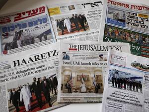 This picture taken on September 1, 2020 in Jerusalem shows the front pages of Israeli and Palestinian newspapers with images of the US-Israeli delegation arriving to Abu Dhabi on the first commercial flight from Tel Aviv to mark the normalisation of ties between the Jewish state and the UAE. MENAHEM KAHANA / AFP
