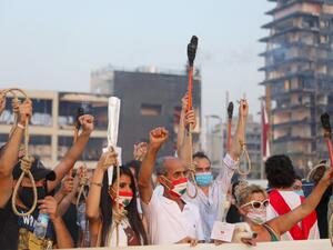 Lebanese demonstrators carry nooses and torches during a demonstration to mark one month since the cataclysmic August 4 explosion that killed 191 people, at Beirut's port area in the Lebanese capital Beirut on September 4, 2020. ANWAR AMRO / AFP