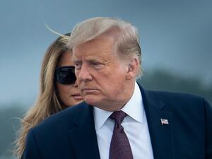 US President Donald Trump and First Lady Melania Trump board Air Force One at Joint Base Andrews in Maryland on September 11, 2020. President Trump and the First Lady travel to Shanksville, Pennsylvania, to attend the 19th anniversary commemoration for the 9/11 attacks. Brendan Smialowski / AFP