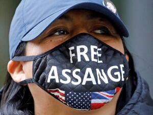 Demonstrators protest outside of the Old Bailey court in central London on September 14, 2020, where the extradition hearing against WikiLeaks founder Julian Assange has resumed. Assange is fighting to avoid extradition to the United States for leaking military secrets. If convicted, Assange -- who has been held at the high-security Belmarsh Prison for the last 16 months -- could be jailed for up to 175 years. Tolga AKMEN / AFP