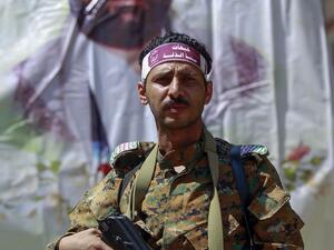 A fighter loyal to Yemen's Huthi rebels stands guard during a rally commemorating the death of Shiite Imam Zaid bin Ali in the capital Sanaa, on September 14, 2020. MOHAMMED HUWAIS / AFP