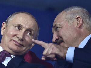 In this file photo taken on June 30, 2019 Russian president Vladimir Putin (L) and Belarus' president Alexander Lukashenko attend the closing ceremony of the 2019 European Games in Minsk. Russian President Vladimir Putin backed embattled Belarusian leader Alexander Lukashenko at talks on September 14, 2020, saying he was sure the Belarusian strongman would see through proposed reforms. "I'm sure that considering your experience... work in this direction will be organised at the highest level and allow the d