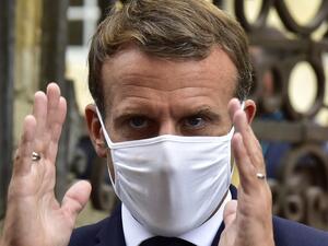 French President Emmanuel Macron, wearing a protective face mask, speaks to the journalists during a visit at the Polignac castle on September 18, 2020 in Condom, on the eve of the European Heritage Days and the third edition of the "Loto du Patrimoine" lottery draw aiming at help restoring heritage sites at risk. GEORGES GOBET / AFP / POOL