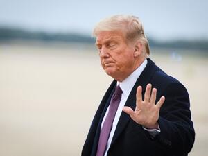 An October 1, 2020 photo shows US President Donald Trump upon arrival at Andrews Air Force Base in Maryland on October 1, 2020 after he returned to Washington, DC following a fundraiser in Bedminster, New Jersey. MANDEL NGAN / AFP