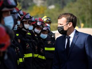 French President Emmanuel Macron (R) meets with members of the Civil Defence during a visit to Tende, in the Vallee de la Roya, some 50kms north-east of Nice, southeastern France, on October 7, 2020. (AFP/File Photo)