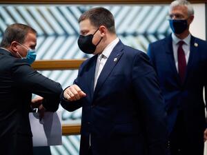 Sweden's Prime Minister Stefan Lofven (L) greets Estonia's Prime Minister Juri Ratas (C) with an elbow bump next to Latvia's Prime Minister Arturs Krisjanis Karins prior a North Baltic countries meeting on the sidelines of a two days European Union (EU) summit at the European Council Building in Brussels, on October 15, 2020. (AFP/File)