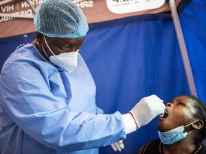 A health worker conducts a COVID-19 coronavirus molecular test in Parkview, Johannesburg, on October 22, 2020, provided free of charge by the City of Johannesburg Health Department. LUCA SOLA / AFP