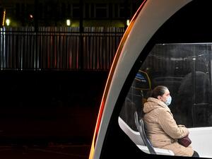 A woman wearing a face mask to protect against the Covid-19 disease uses a tram in Moscow on October 23, 2020, amid the ongoing coronavirus pandemic. Russia confirmed 17,340 new Covid-19 daily cases including 5,478 in Moscow on October 23, 2020. Kirill KUDRYAVTSEV / AFP
