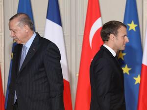 In this file photo taken on January 5, 2018 French President Emmanuel Macron (R) and Turkish President Recep Tayyip Erdogan walk during a joint press conference at the Elysee Palace in Paris. Turkish President Recep Tayyip Erdogan slammed on October 24, 2020 his French counterpart, Emmanuel Macron, over his policies toward Muslims, saying that he needed "mental checks." "What can one say about a head of state who treats millions of members from different faith groups this way: first of all, have mental chec
