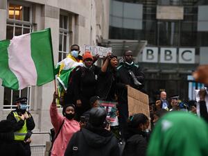 Protestors shout slogans during a protest action against police brutality in Nigeria, outside the BBC offices in central London on October 24, 2020. UN Secretary General Antonio Guterres has called for an end to what he called "brutality" by police in Nigeria, which has been rocked by two weeks of protests. Guterres said gunmen that opened fire on peaceful protesters Tuesday evening in Lagos caused "multiple deaths" and many injuries. DANIEL LEAL-OLIVAS / AFP