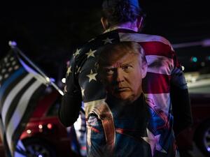 Supporters of U.S. President Donald Trump rally outside Walter Reed National Military Medical Center on October 3, 2020 in Bethesda, Maryland. Trump arrived at the hospital yesterday after testing positive for COVID-19. Alex Edelman/Getty Images/AFP Alex Edelman / GETTY IMAGES NORTH AMERICA / Getty Images via AFP