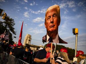 Supporters of President Donald Trump gather outside of Walter Reed National Military Medical Center after the President was admitted for treatment of COVID-19 on October 4, 2020 in Bethesda, Maryland. The President announced via Twitter early Friday morning that he had tested positive. Numerous other prominent GOP figures and members of Congress have also tested positive in the last few days. Samuel Corum/Getty Images/AFP Samuel Corum / GETTY IMAGES NORTH AMERICA / Getty Images via AFP