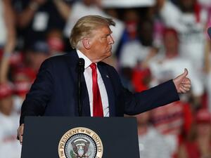 President Donald Trump speaks during his campaign event at the Orlando Sanford International Airport on October 12, 2020 in Sanford, Florida. (AFP)